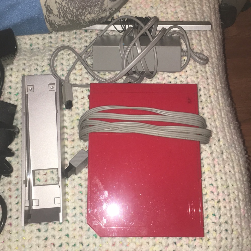 Wii with stand and remotes.